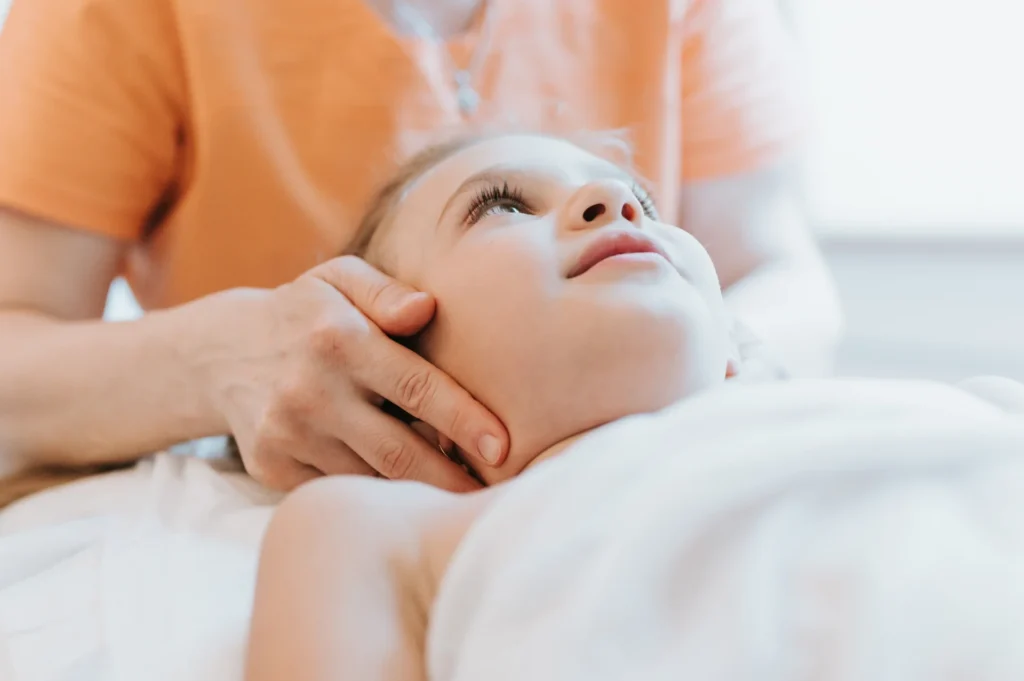 young child receiving facial massage therapy at sp 2026 03 17 20 11 27 utc 1